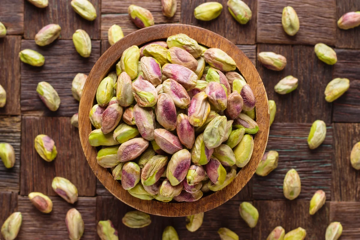 a bowl full of pistachio kernels